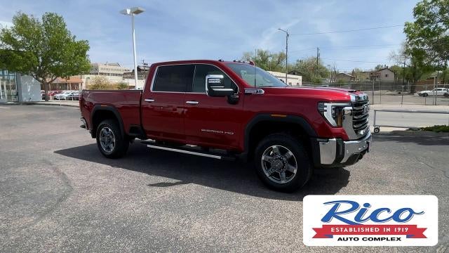 2026 GMC Sierra 2500 HD SLT in Volcanic Red Tintcoat — front three-quarter view