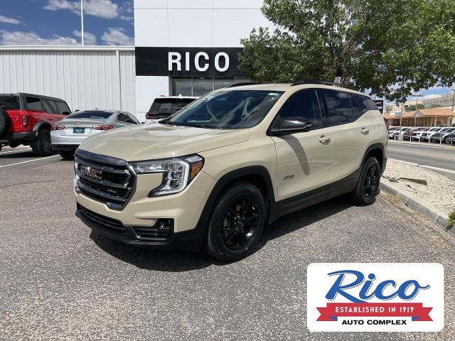 2022 GMC Terrain AT4 in Desert Sand Metallic — front three-quarter view